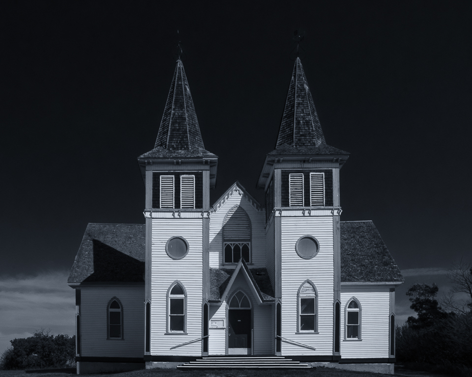 A church building with two towers, one on each side of the entrance